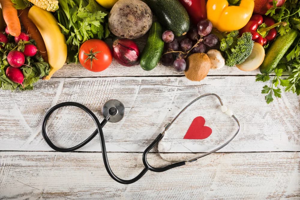A stethoscope among fresh fruit and vegetables