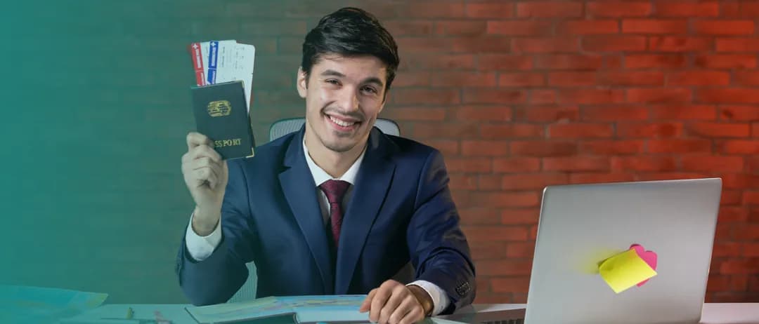 A man in a suit holding a passport at a desk