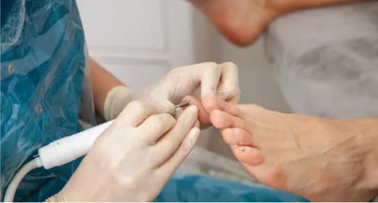 A podiatrist treating a patient’s foot
